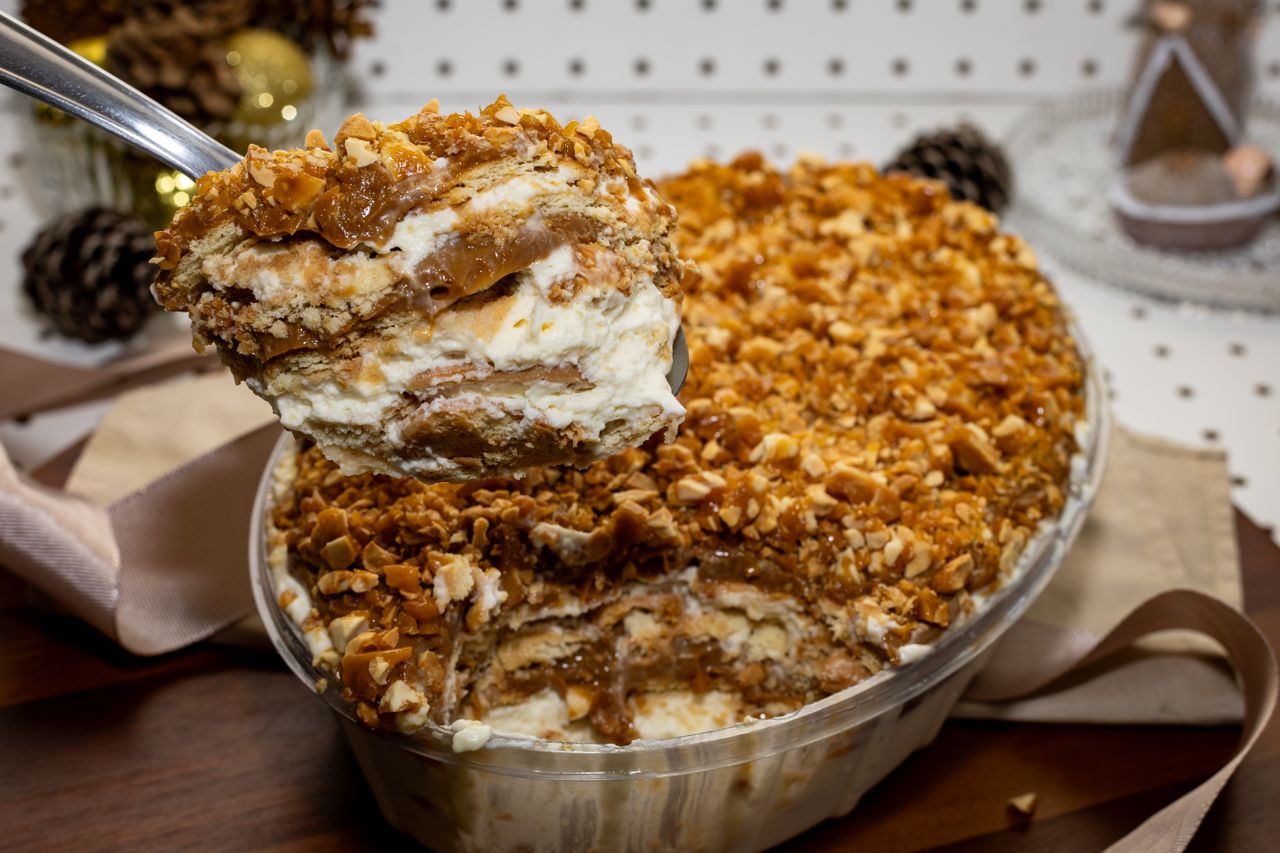Indulgent dessert with layers of cream, caramel, and crunchy nuts, perfect for festive occasions.
